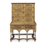 A Queen Anne or George I walnut, burr oak and featherbanded chest on stand 1700-1725, the legs a...