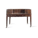 A late George III or Regency mahogany and ebonised line-inlaid Carlton House desk 1800-1805