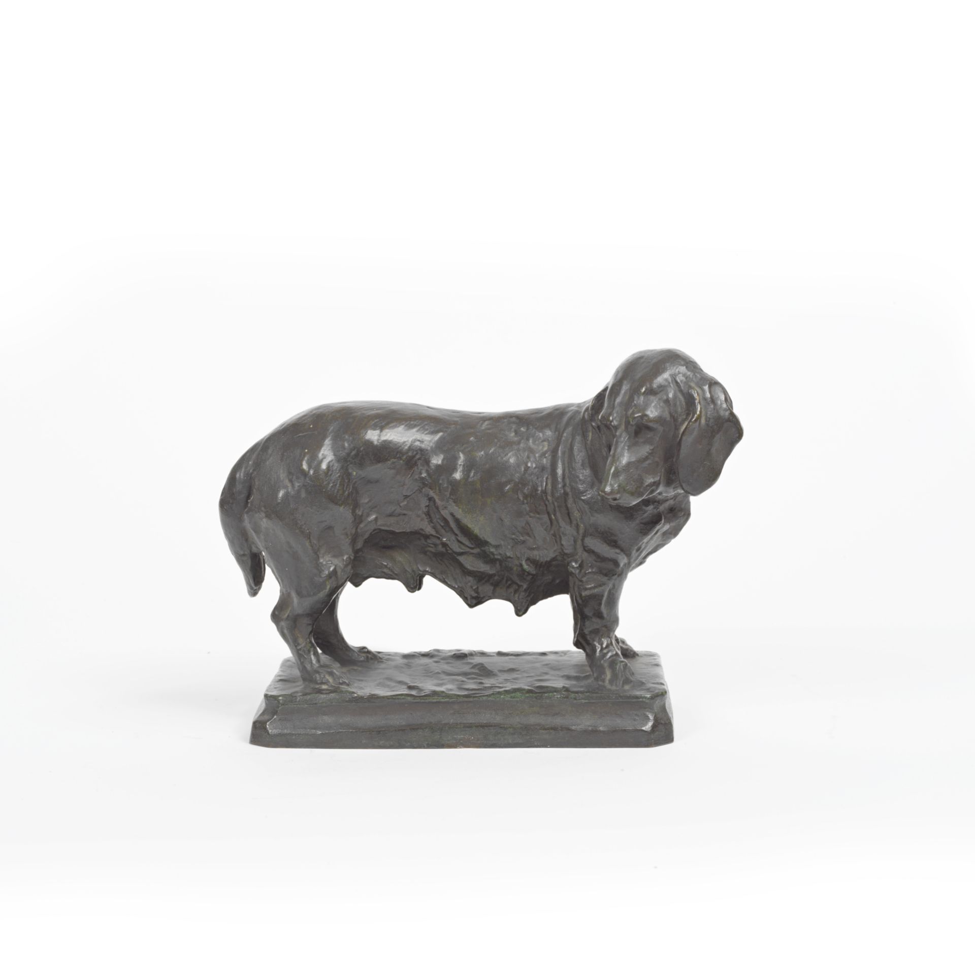An patinated bronze model of a basset hound