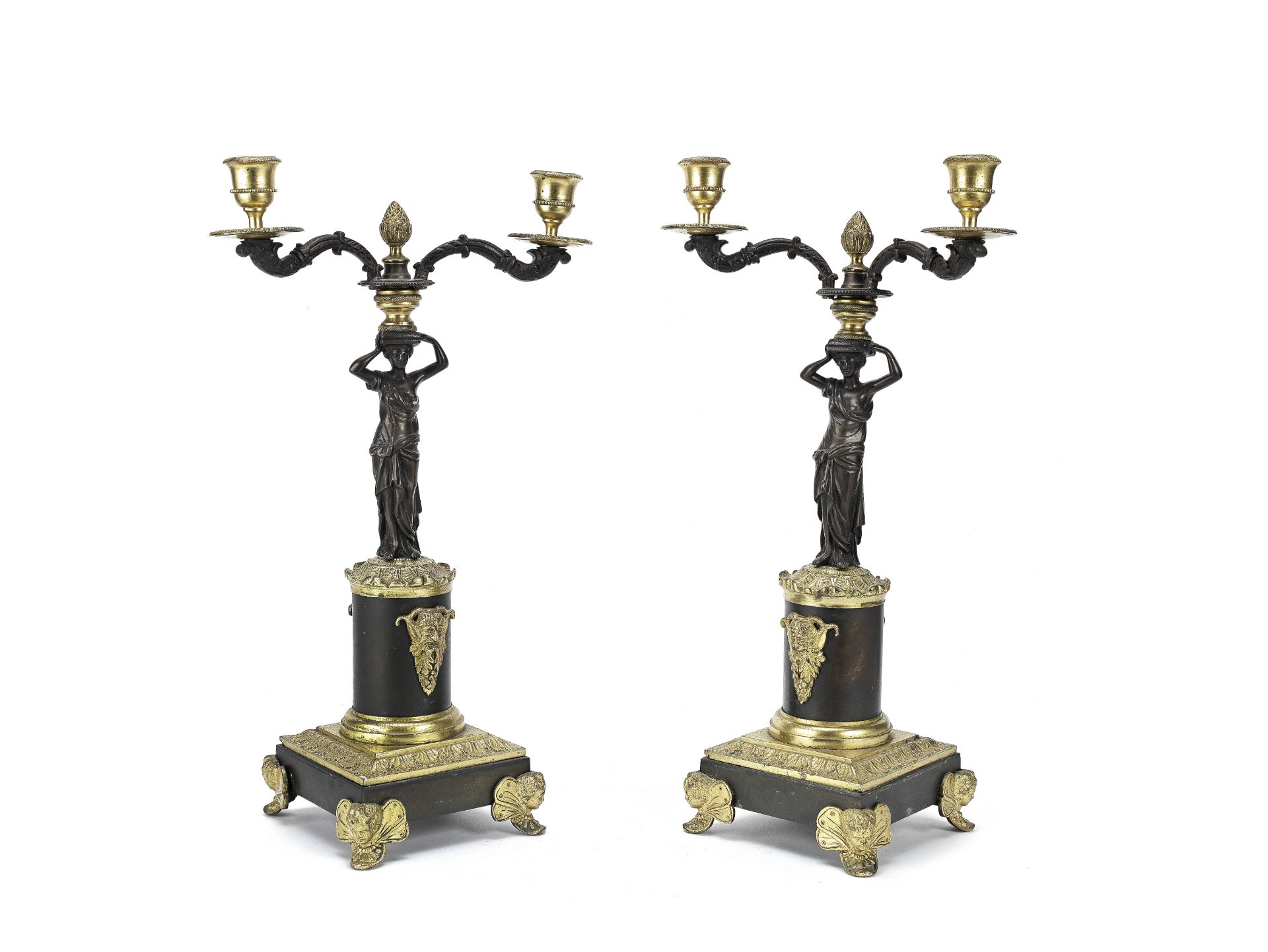 A pair of 19th century and later gilt and patinated bronze twin-light figural candelabra (2)