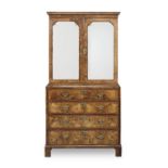 A George I or George II walnut and featherbanded secretaire cabinet 1725-1730