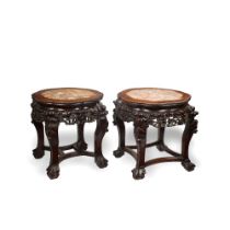 A pair of late 19th Century carved oriental hardwood urn stands (2)