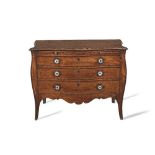 A George III mahogany serpentine commode In the manner of John Cobb