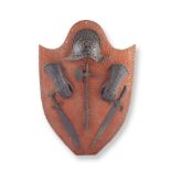 A mid 19th century French patinated iron military armour display in the Renaissance style, in t...