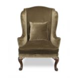 A mid or third quarter 18th century walnut and ash wingback armchair
