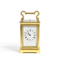 An early 20th century French lacquered brass carriage clock with repeat