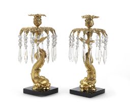 A pair of gilt bronze dolphin form lustre candlesticks (2)