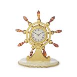 An early 20th century gilt brass, agate and onyx ships wheel desk timepiece the case with applie...