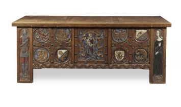 A large early 20th century gothic revival oak and polychrome decorated sideboard in the form of ...