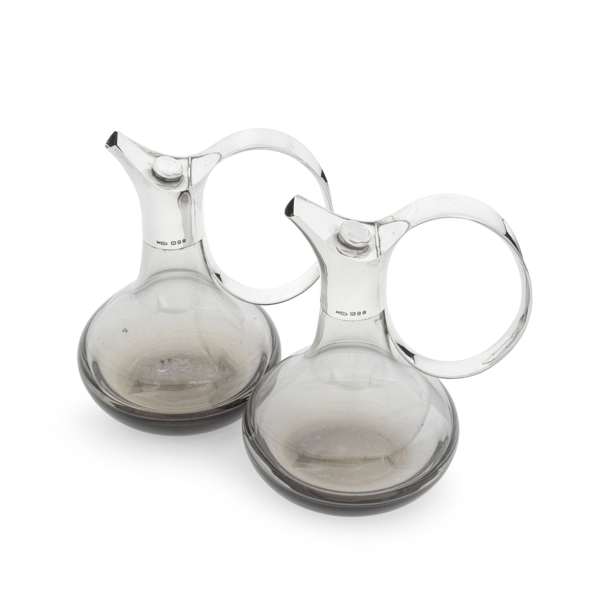 A pair of silver-mounted smokey glass claret jugs Christopher Bowen, London 1979 (2)