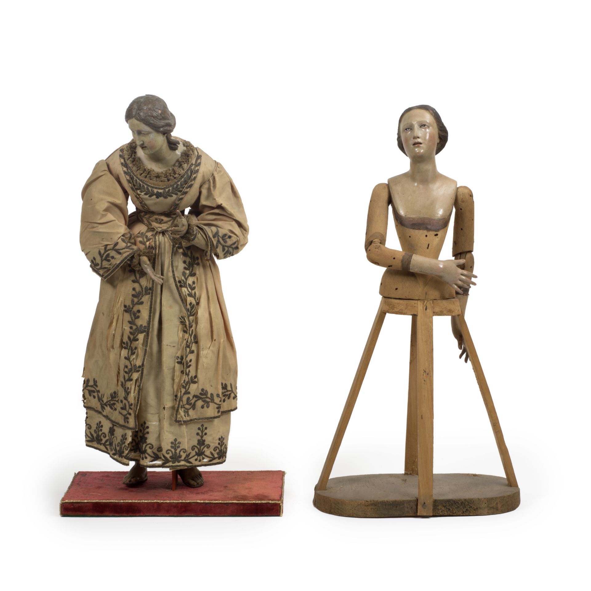 Two 18th century southern European carved wood and composition female crib figures on stands (2)