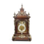 A late 19th / early 20th century gilt brass mounted walnut chiming bracket clock with bracket t...
