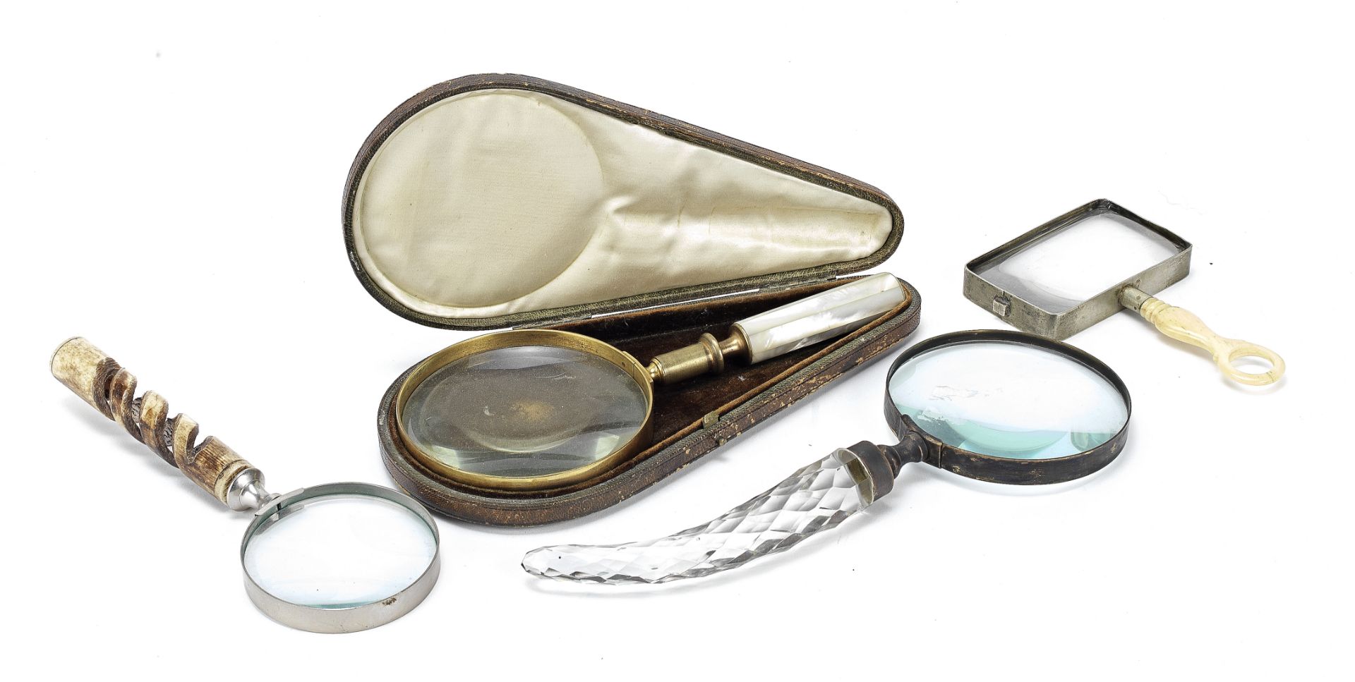 A collection of four desk magnifying glasses late 19th and 20th century (4)