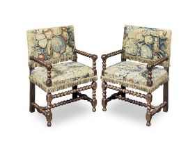A near pair of mid 19th century Franco-Flemish walnut low armchairs in the late 17th century st...