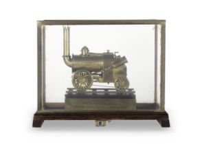 A railway station coin operated display model of the Rocket locomotive, English, early 20th ce...