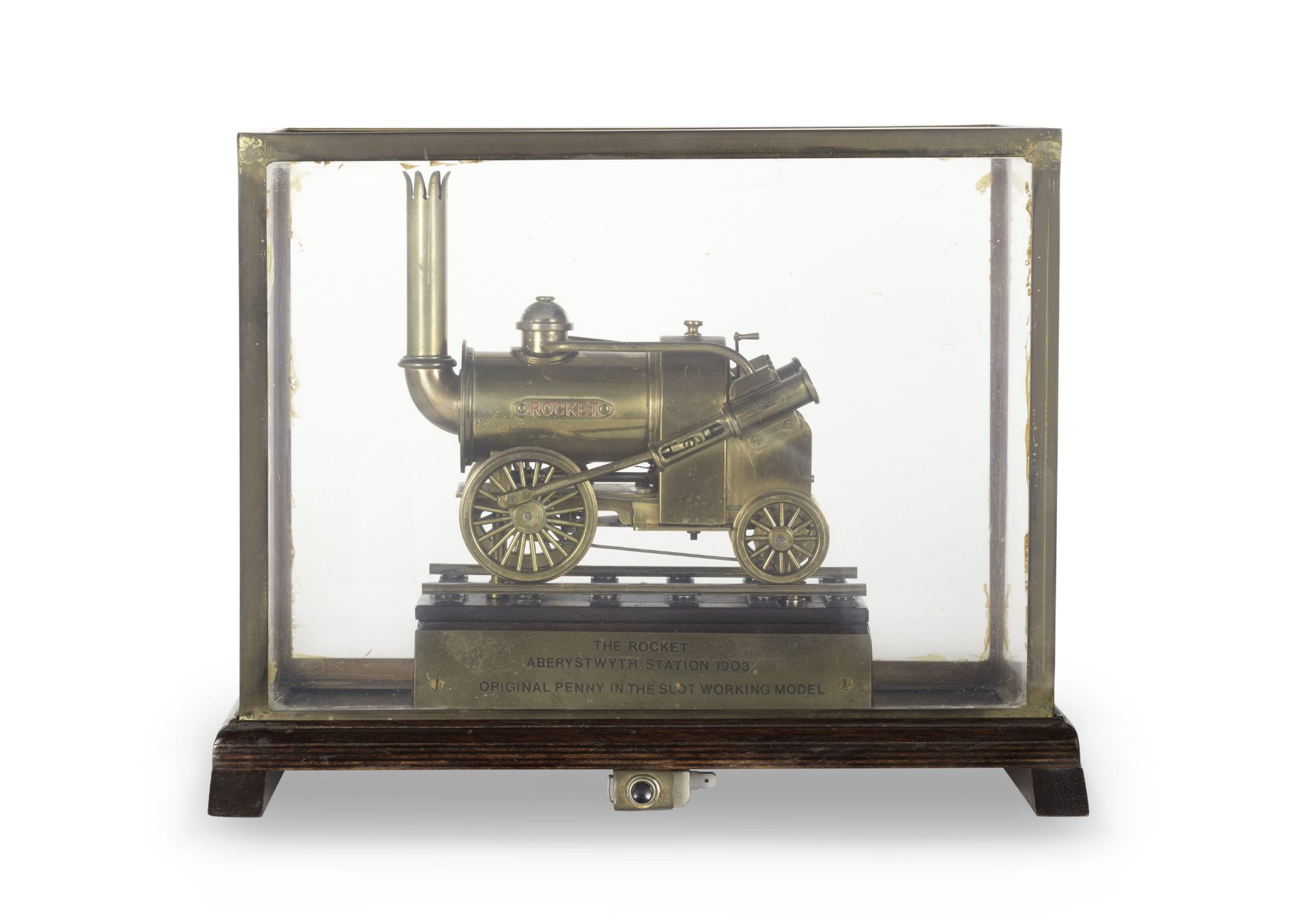 A railway station coin operated display model of the Rocket locomotive, English, early 20th ce...