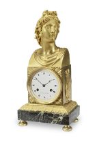 An early 19th century French gilt bronze and verde antico marble mantle clock the dial signed Pr...