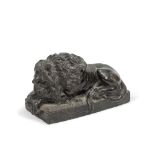 A late 19th century carved serpentine marble model of a sleeping lion After Antonio Canova (Ita...