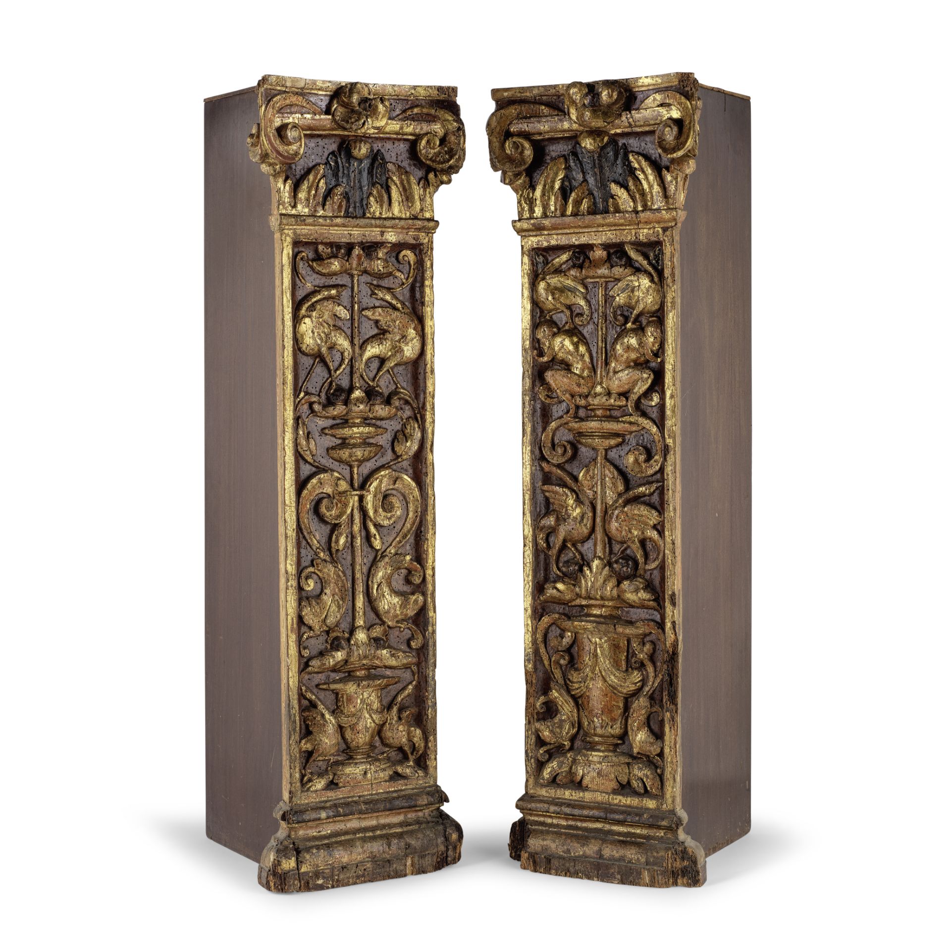 A near pair of 18th century and later Italian carved and gilt gesso pedestals in the Baroque sty...