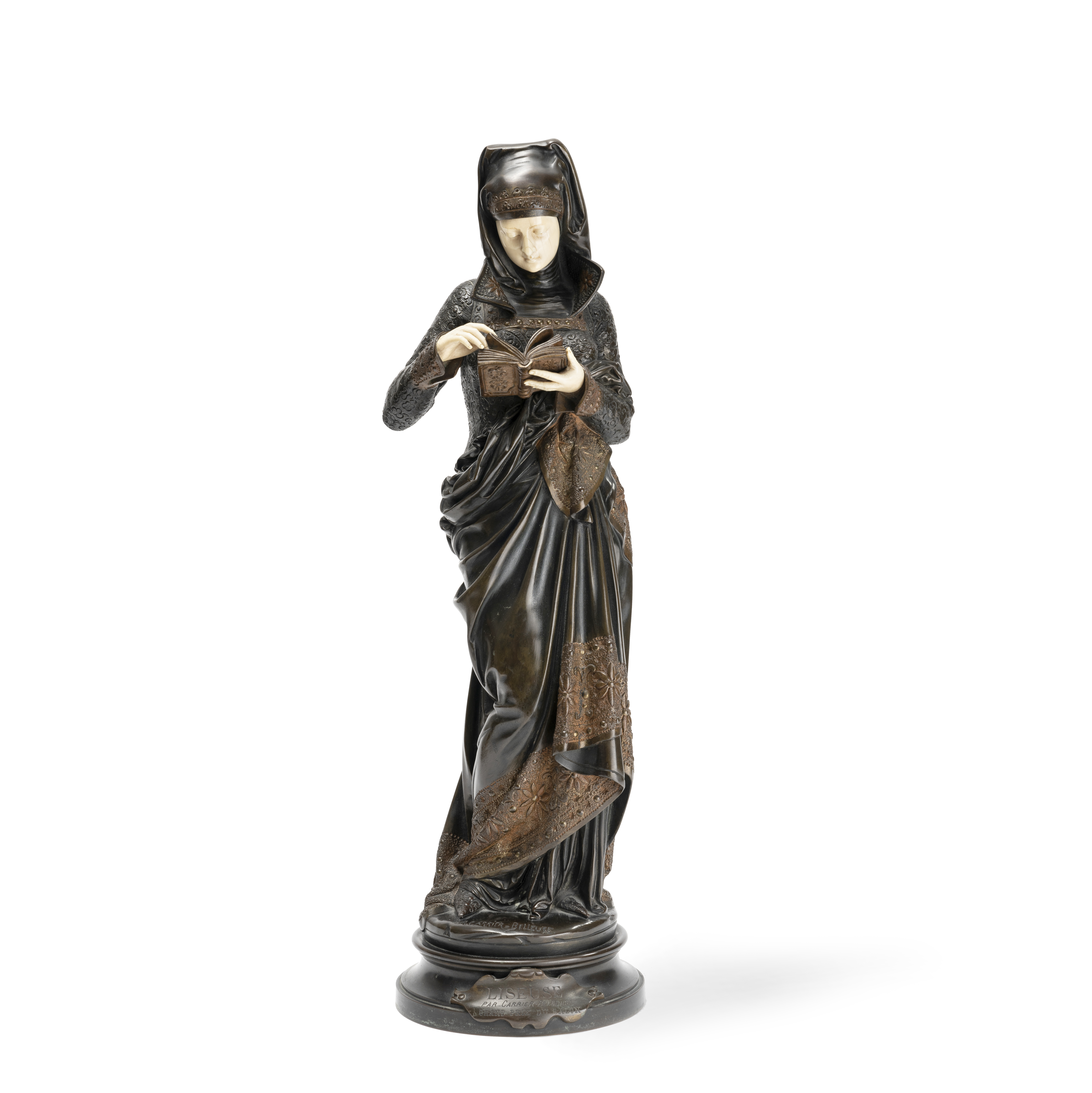 After Albert Carrier Belleuse (French, 1824-1887): A bronze and ivory model of 'La Liseuse'