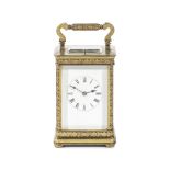 An early 20th century French gilt brass carriage clock with repeat