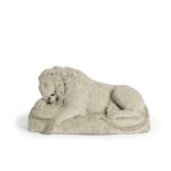 A carved marble figure of a sleeping lion after Antonio Canova (Italian, 1757-1822)