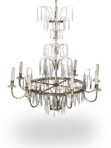 A late 19th/early 20th century silvered metal and cut glass eight light chandelier probably Italian