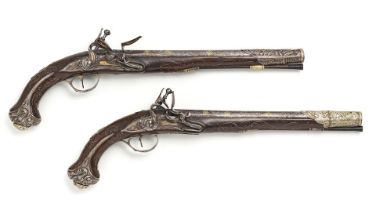 A pair of Ottoman silver-mounted gold-damascened steel flint lock pistols Turkey, period of Mahm...