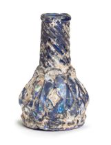 A mould-blown blue glass flask fragment Persia, 11th/ 12th Century
