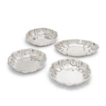 A set of four German silver bowls / dishes with maker's mark and crown and crescent mark, stampe...