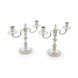 A pair of silver two-light candelabra R Comyns, London 1957 and 1958