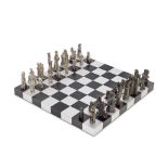 A silver surrealist style chess set titled Jeu d'échecs, 1973, Belgian, signed Vic Gentils,...