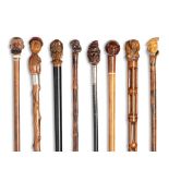 A collection of eight carved wood novelty walking sticks and canes late 19th / early 20th centur...