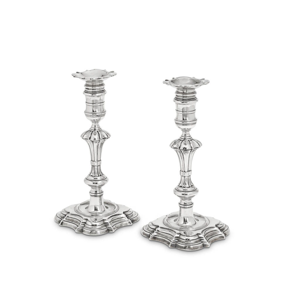 A pair of George II cast silver candlesticks James Gould, London 1739, date letter in a shaped p...