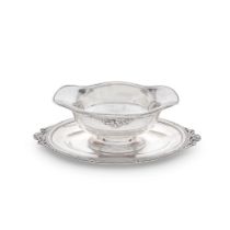 A French silver double lipped sauceboat on stand Hènin & Cie, with French first standard Mi...