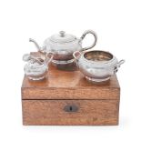 A French silver three-piece tea service, all contained in a fitted wood box Emile Hugo, with fir...