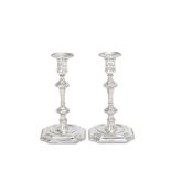 A rare pair of George I / II provincial cast silver candlesticks with two maker's marks, possibl...