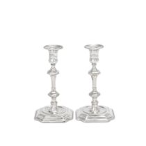 A rare pair of George I / II provincial cast silver candlesticks with two maker's marks, possibl...