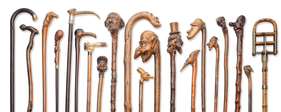 A good collection of novelty carved briar and other wood walking sticks and canes, the majority...