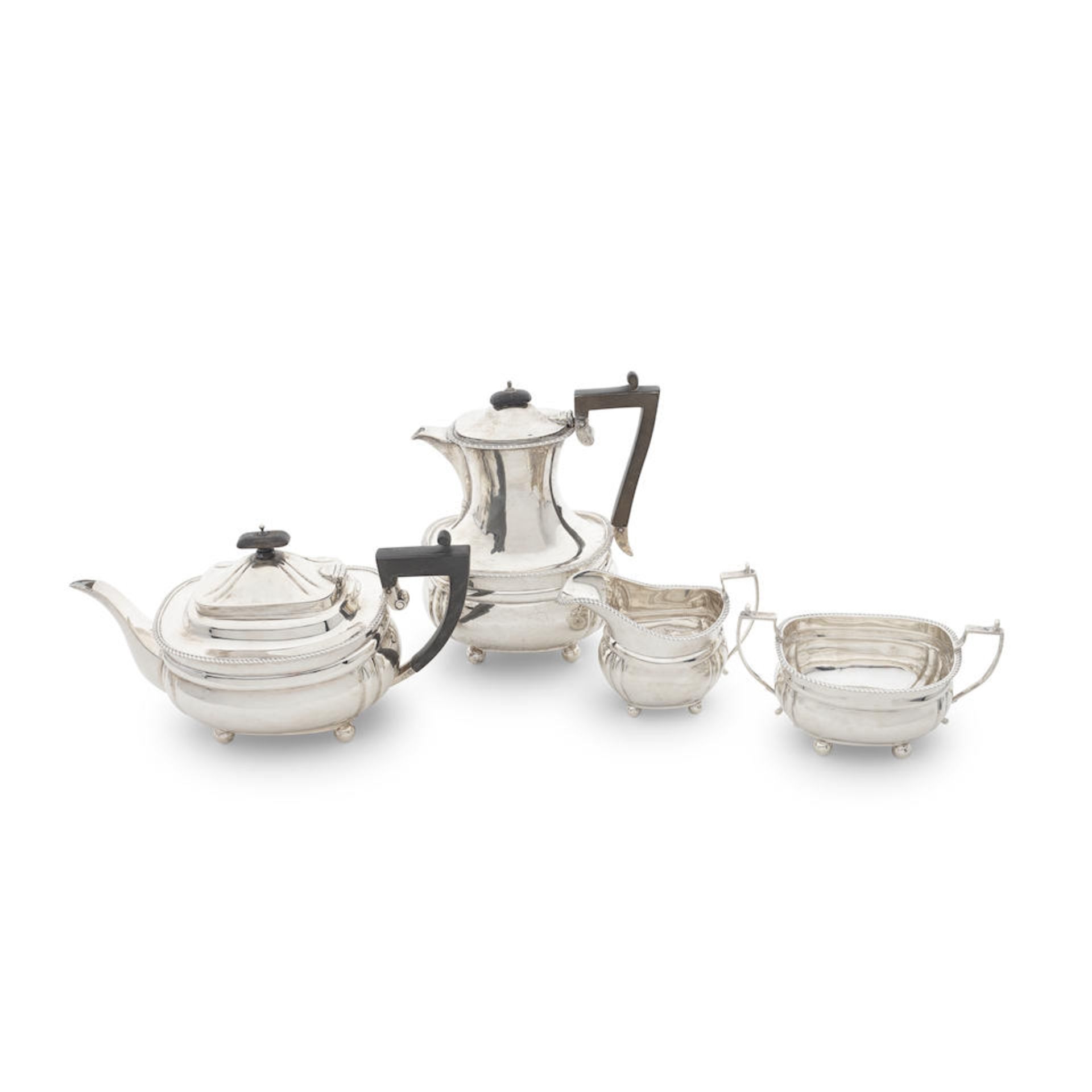 A silver four-piece tea and coffee service Mappin & Webb, London 1914 and Birmingham 1915 (4)