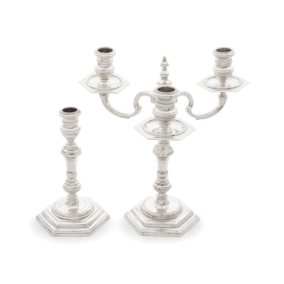 A pair of cast silver candlesticks, one with a three-light branch section R Comyns, London 1965 ...