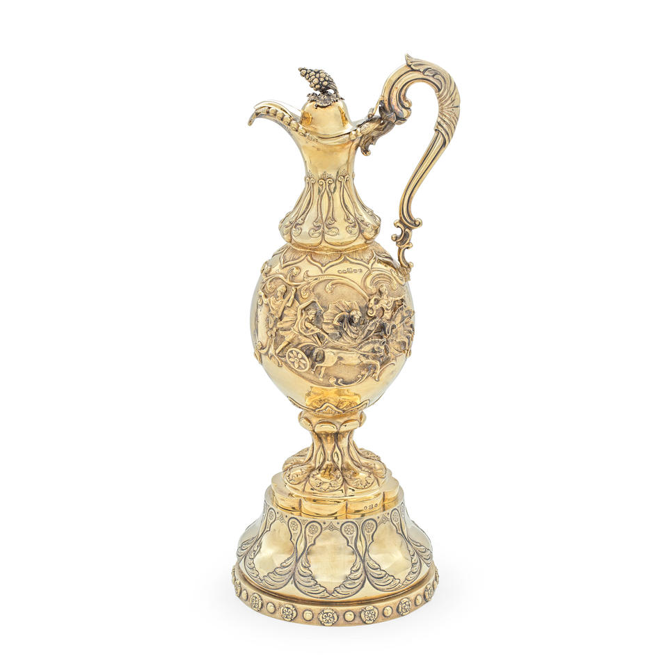 A Victorian silver-gilt ewer and a matched stand James & Josiah Williams, Exeter 1865, the stan...