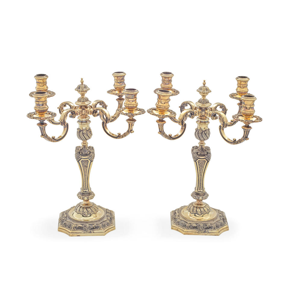 A pair of 18th century style cast silver-gilt four-light candelabra, after Paul de Lamerie C J V...