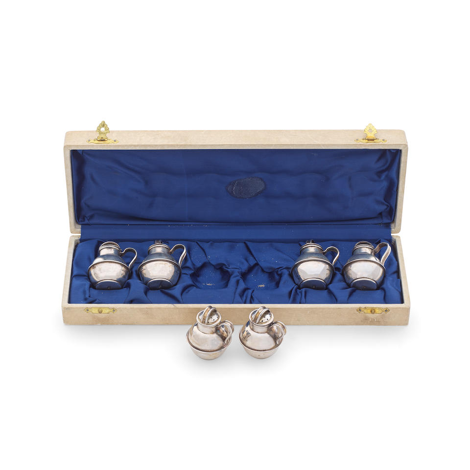 A cased set of six Continental silver 'Guernsey' style jugs modelled as small pepper shakers onl...