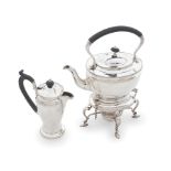 A silver kettle on stand James Dixon, Sheffield 1920 together with a silver hot water pot, Birmi...