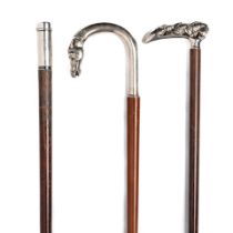An early 20th century Tiffany and Co. white metal mounted novelty walking cane together with a l...