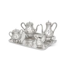 A French silver four-piece tea and coffee service together with a tray Edmond Tetard, Paris, wit...