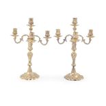 A pair of George II cast silver-gilt candlesticks with Victorian four-light branch sections Joh...
