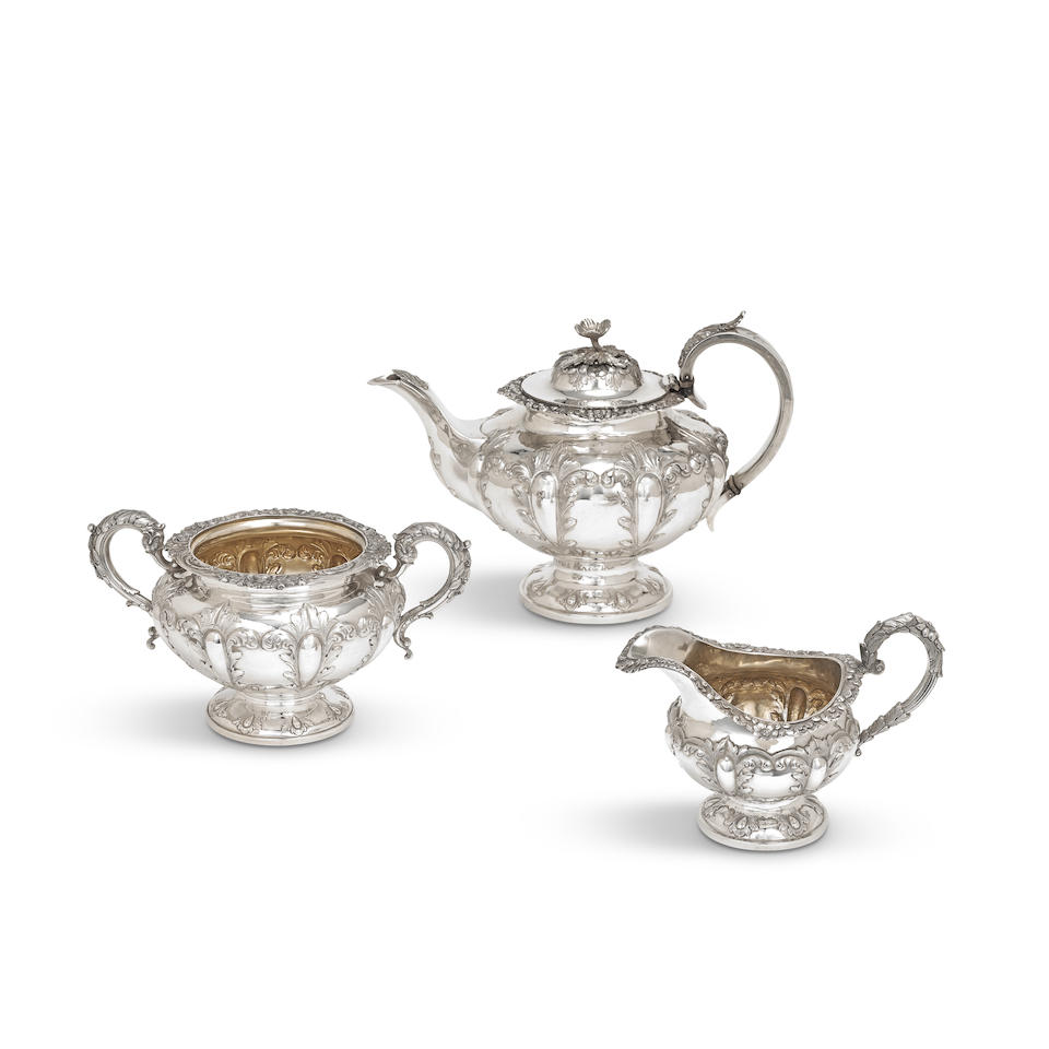 A matched Victorian silver three-piece tea service teapot and cream jug, William Hunter, London ...