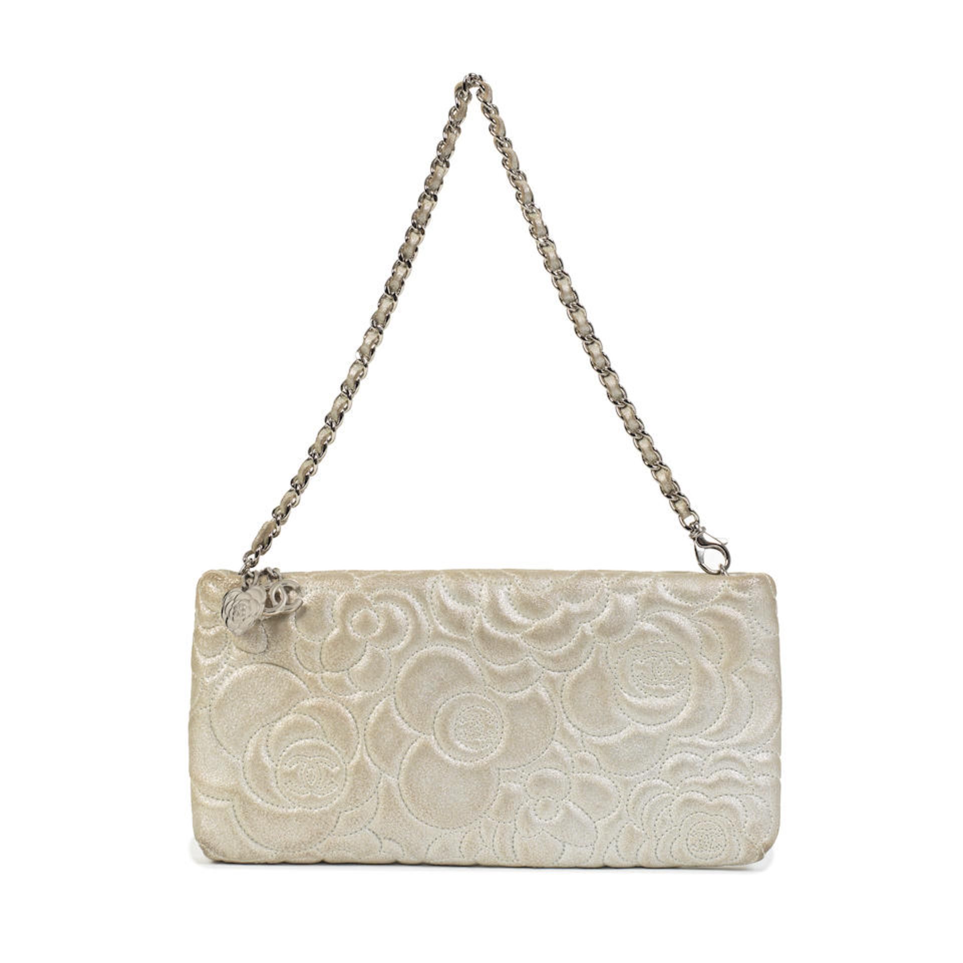 Karl Lagerfeld for Chanel: a Silver Leather Camellia Pochette VIP Gift 2014-15 (includes serial ...